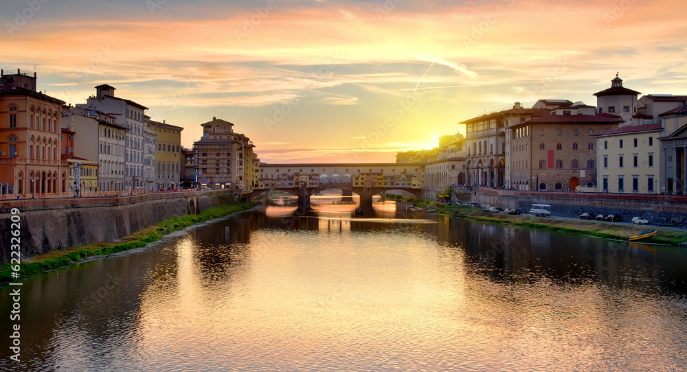 Ponte Vecchio on the river Arno in Florence at sunrise, Italy