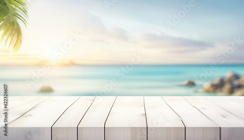 White wood table top with beautiful ocean view and palm leaf lots of copy space