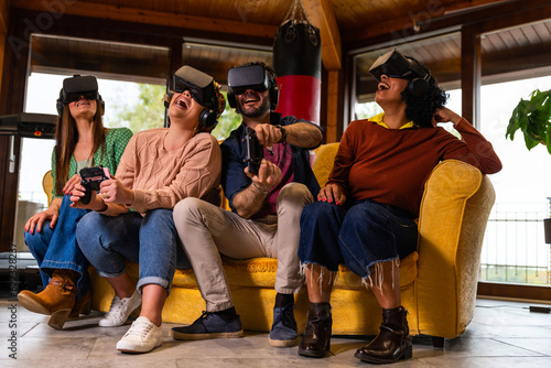 Multiracial young students wearing virtual reality glasses indoor – multicultural young people having fun new technology vr headset goggles – diverse friends using virtual reality glasses © GiuseppeElioCammarat