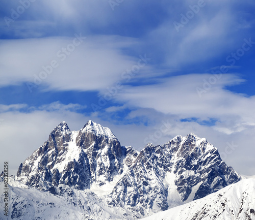 Mounts Ushba and Chatyn and blue sky with clouds in winter day. Caucasus Mountains. Svaneti region of Georgia. © Designpics