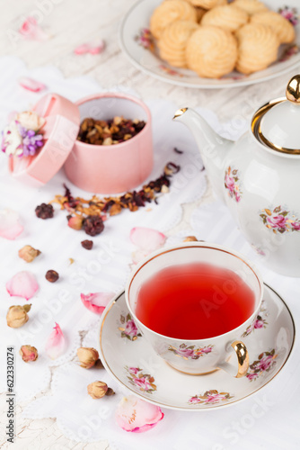 cup of red tea on white serving table