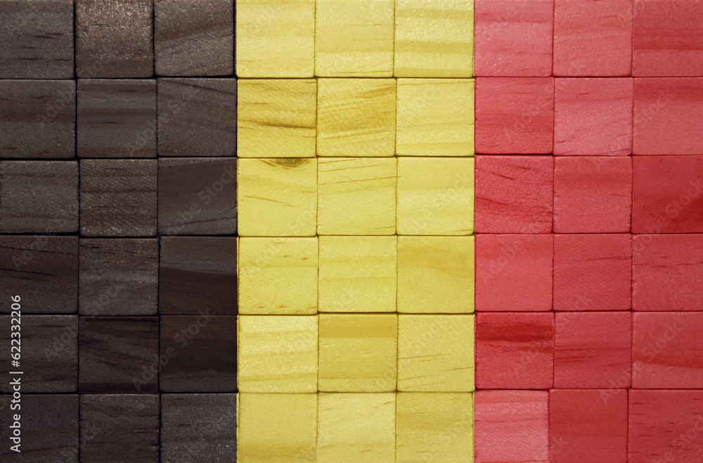 Φωτογραφία colorful painted big national flag of belgium on a wooden cubes texture