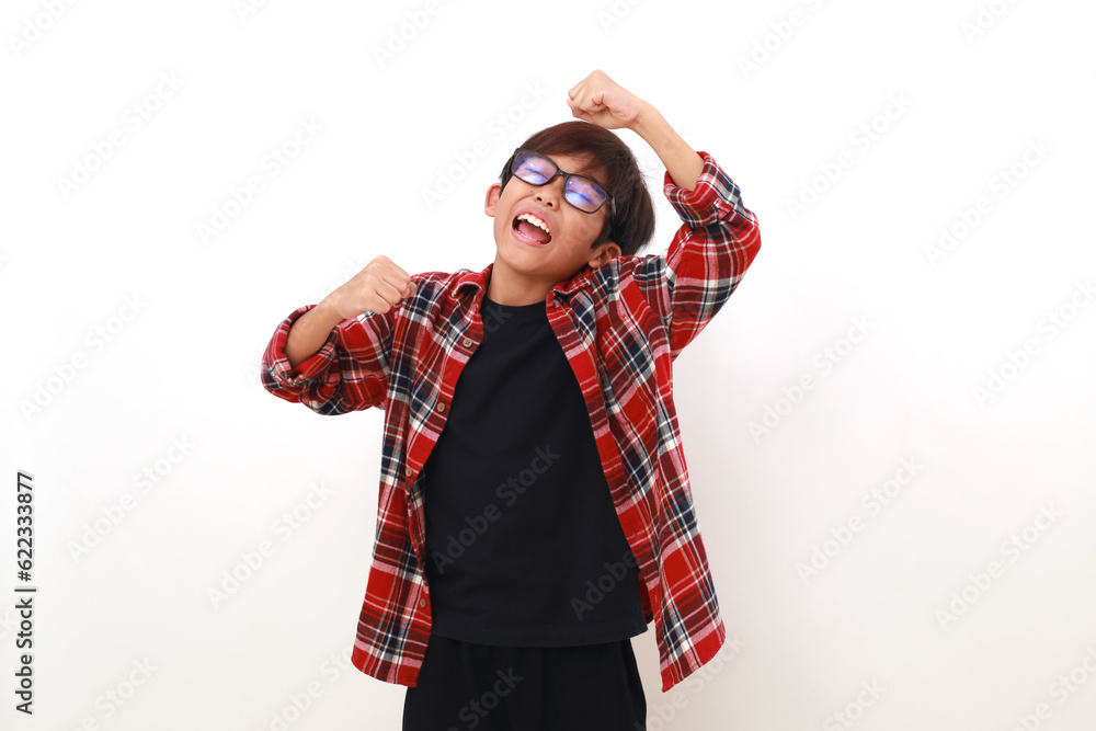 Cheerful asian boy standing while dancing. Isolated on white background Cheerful asian boy standing while dancing. Isolated on white background