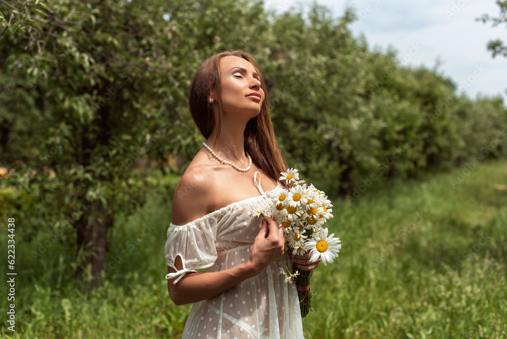 Walk with a woman in an apple orchard Walk with a woman in an apple orchard