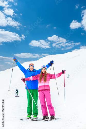 Young couple with skis outdoors