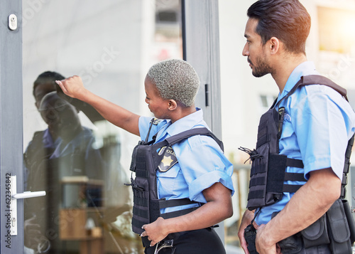 Valokuva Crime, patrol and police knocking on a door for justice, security and law at a home