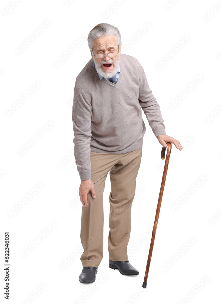 Senior man with walking cane suffering from knee pain on white background Senior man with walking cane suffering from knee pain on white background