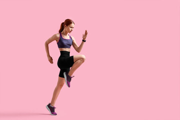 Young woman in sportswear running on pink background, space for text