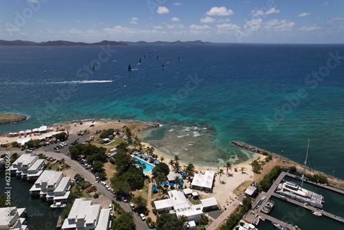 Windsurfers and boats off the island of Tortola drone view