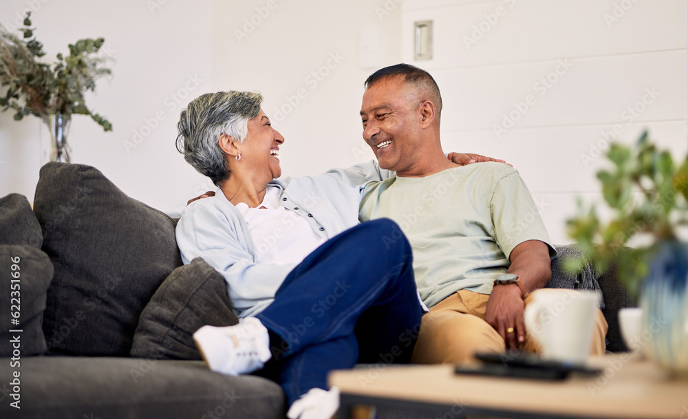 Obraz premium Love, smile or laughing senior couple bonding, relax and enjoy quality time together, funny conversation or chat. Lounge communication, marriage humour or elderly people laugh at home retirement joke