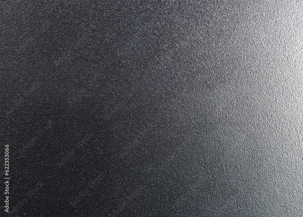 Black Sand blasting aluminum texture, with light on right side. Stock Photo Adobe Stock