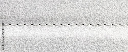 Photos close up beige or white leather texture with stitched or seam background