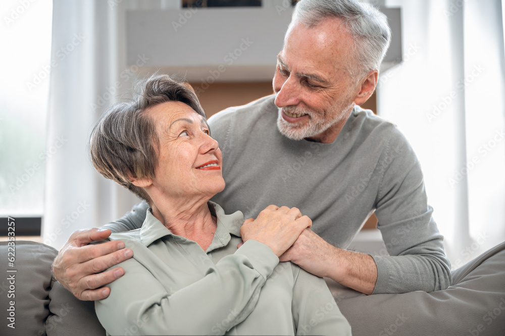 Smiling mature couple looking to each other and hugging Smiling mature couple looking to each other and hugging