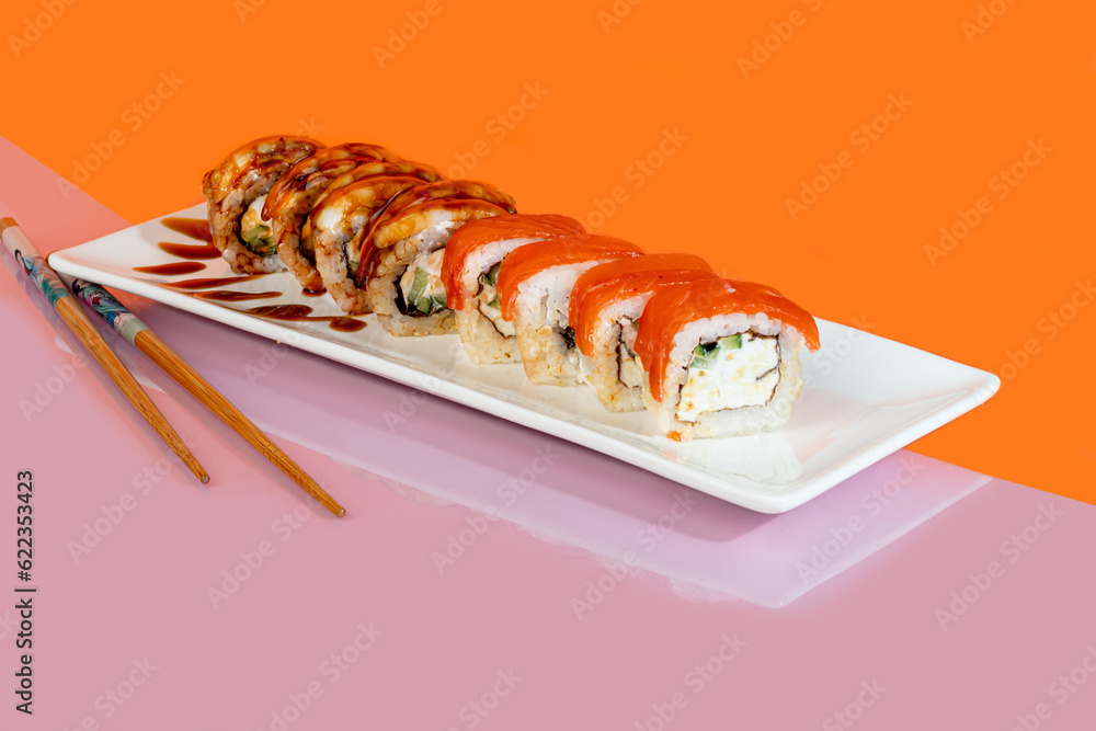 Sushi sets, rolls with caviar, shrimp, tuna and avocado and Philadelphia cheese, on a white plate. Sushi sets, rolls with caviar, shrimp, tuna and avocado and Philadelphia cheese, on a white plate.