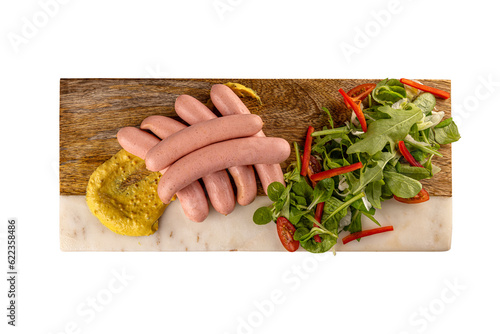 Wiener served with mustard and green lettuce photo