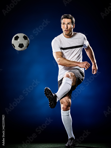 one caucasian soccer player man isolated on black background © Designpics
