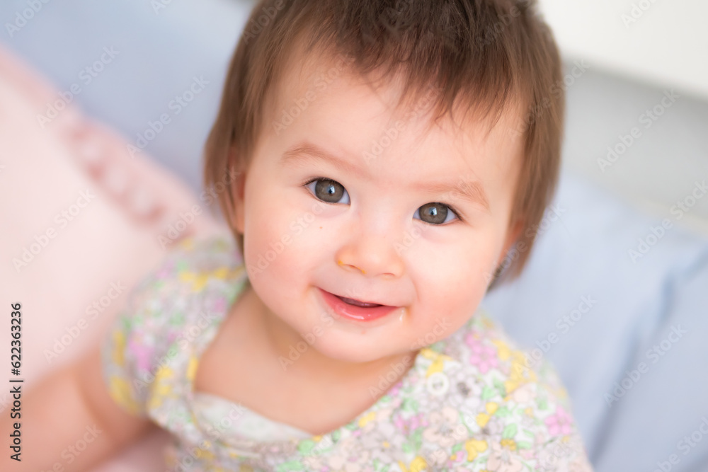lifestyle home portrait of happy and adorable 9 months old mixed ethnicity Asian Caucasian baby girl playing cheerful and carefree on bed looking sweet and cute in childhood concept lifestyle home portrait of happy and adorable 9 months old mixed ethnicity Asian Caucasian baby girl playing cheerful and carefree on bed looking sweet and cute in childhood concept