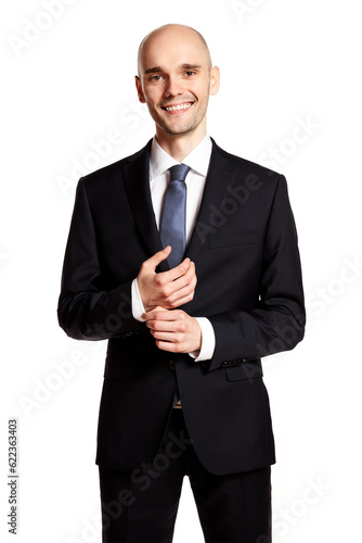 Studio shot of cheerful elegant young man against white background.