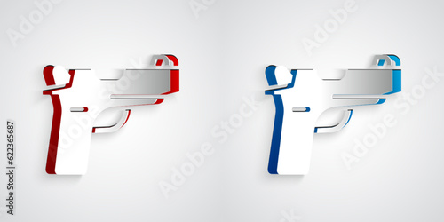 Paper cut Pistol or gun icon isolated on grey background. Police or military handgun. Small firearm. Paper art style. Vector
