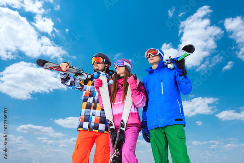 Young people with skis in winter