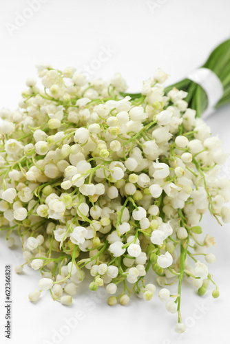 Beautiful lily of the valley bouquet on white background, closeup