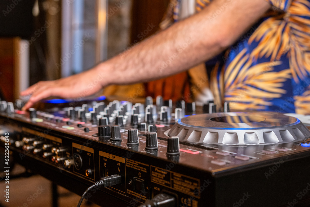 DJ Hands creating and regulating music on dj console mixer in concert party outdoor openair DJ Hands creating and regulating music on dj console mixer in concert party outdoor openair