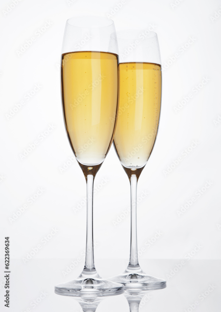 Glasses of sparkling champagne with bubbles on white background Glasses of sparkling champagne with bubbles on white background
