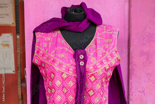 indian colorful pink and purple dress with golden pattern photo