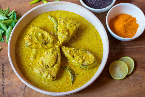 selective focus of Illish or Hilsa fish cooking with mustard seed.famous in India and Bangladesh.  photo