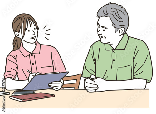高齢者と会話する女性スタッフ（介護士）
