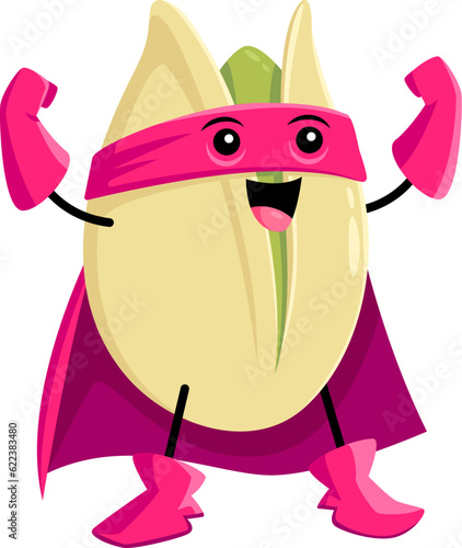 Cartoon pistachio nut character showing muscles. Happy nutty food vector personage of white nutshell and green kernel in cute super hero costume, pink coat, mask and gloves. Funny pistachio nut emoji