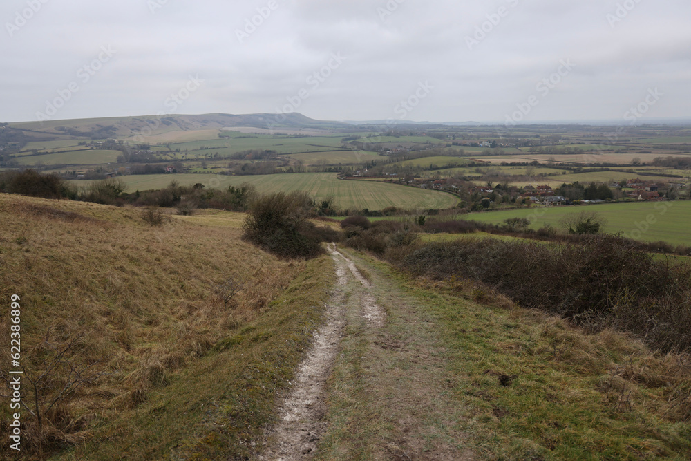 A Winter walk in East Sussex to see the Seven Sisters, Cuckmere Haven and the Long Man of Wilmington. A calming walking weekend on Englands chalk cliff coastline.