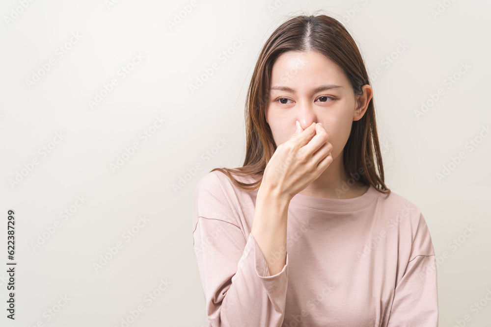 Bad smelling, deodorant asian young woman hand squeeze, covering nose smell stink, breathing smelly disgust strong, expression face dislike odor, smelly armpit underarm. Medical health, skin body care Bad smelling, deodorant asian young woman hand squeeze, covering nose smell stink, breathing smelly disgust strong, expression face dislike odor, smelly armpit underarm. Medical health, skin body care