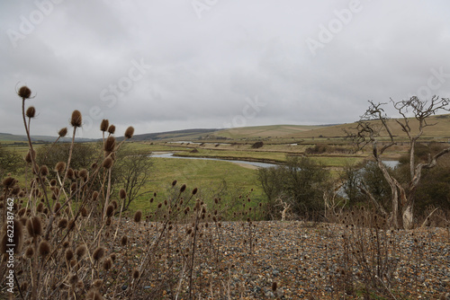 A Winter walk in East Sussex to see the Seven Sisters, Cuckmere Haven and the Long Man of Wilmington. A calming walking weekend on Englands chalk cliff coastline. photo