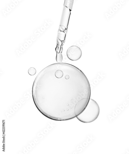 soft water bubble or cosmetic liquid serum drops with laboratory glass pipette on white background