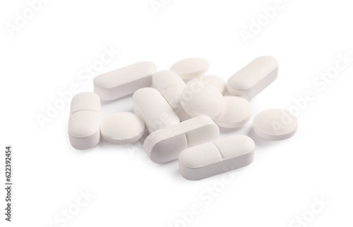 Many pills isolated on white. Medicinal treatment