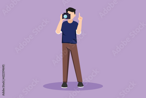 Cartoon flat style drawing male photographer pointing up and using professional camera in studio. Standing and giving count gesturing for taking pictures or photos. Graphic design vector illustration