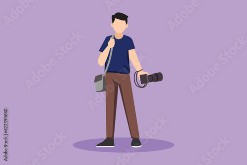 Cartoon flat style drawing young male photographer standing and holding camera with bag in photo studio. Photographer using professional camera for taking pictures. Graphic design vector illustration