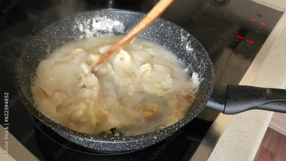 Preparation of onion sauce into frying pan Preparation of onion sauce into frying pan