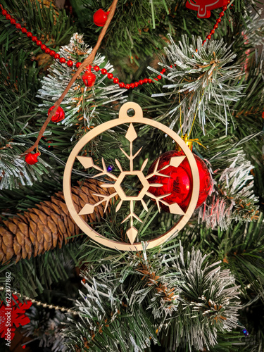 Wooden round decorations for the Christmas tree. Christmas decoration on the tree.
