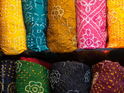 Colorful indian female cloths stack in wholesale shop