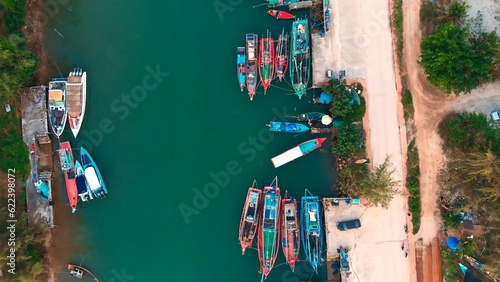 Aerial top view of Sudan harbor with boats by coast. Cinematic beautiful drone shot of Sudan harbor with boats by coast in daytime. Come on vacation to Sudan harbor to fish on boats by coast. © ShantiMedia