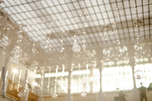 Lovely lanterns decorate the ceiling at a wedding.