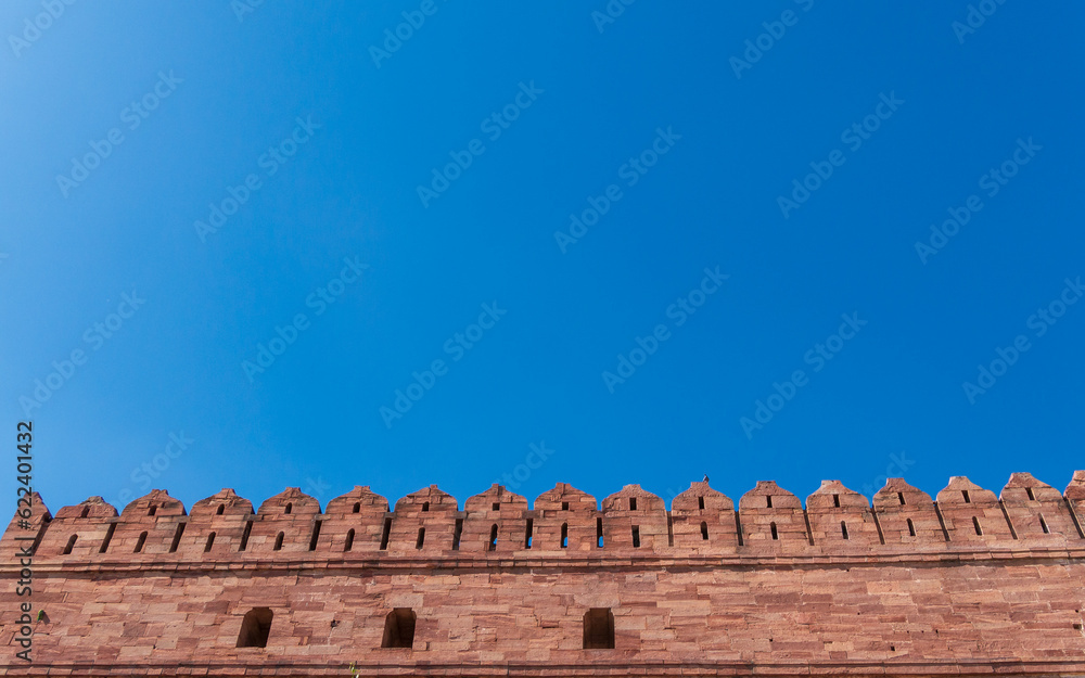 Facade of Rajasthan palace or fort with blue sky