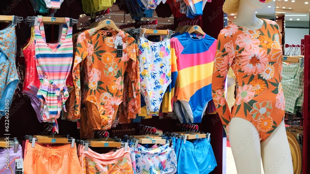 Cinematic video women's colored swimwear for on display in store. Slow