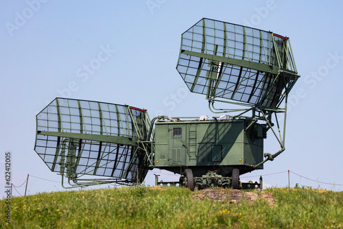 Soviet and russian military radar station with antenna. Air defense. Modern army industry.