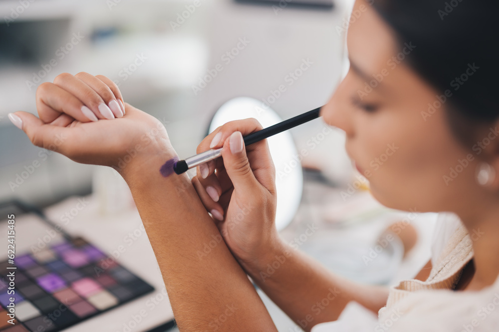 Crop visagiste applying eyeshadow on wrist Crop visagiste applying eyeshadow on wrist