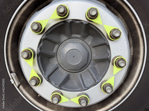 Truck wheel and tire and new nuts indicators