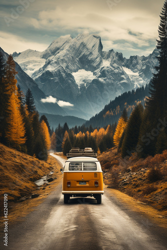 Tablou canvas Camper van driving through the mountains