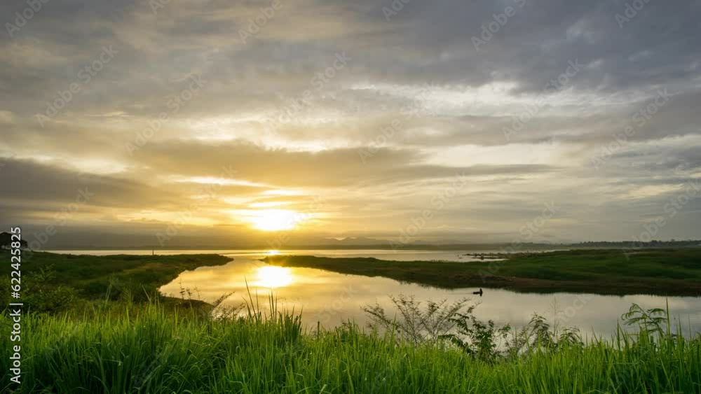 Timelapse Sunset over the reservoir, orange light in the evening on a cloudy day. Timelapse Sunset over the reservoir, orange light in the evening on a cloudy day.